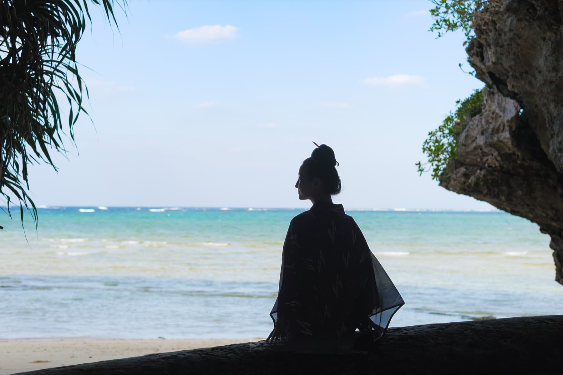 Ayumi with her sanshin by the sea
